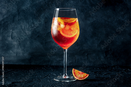 Wallpaper Mural Aperol Spritz, cocktail with sparkling wine, with a blood orange on a dark background, side view with copy space Torontodigital.ca