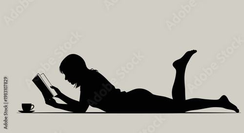Silhouette of a person reading a book with a coffee cup.