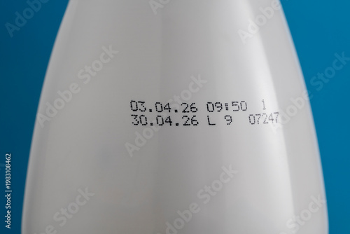 Фотография Expiration date printed on white bottle with dairy product