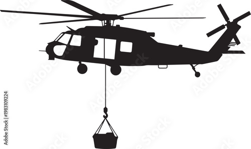 Military helicopter transporting heavy cargo using external hoist system