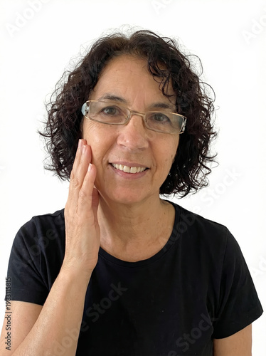 Cheerful woman with glasses and dark curly hair