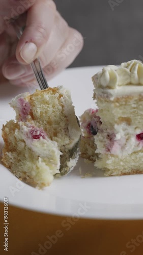 Close-up of Spoon Scooping Fruit Cream Cake