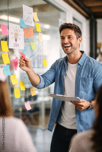 portrait of a young man holding a credit card