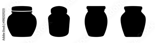 Set of four minimalist black ceramic jars isolated on white background