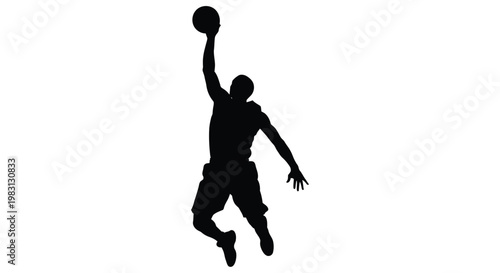 Silhouette of a basketball player in mid air preparing to dunk the ball