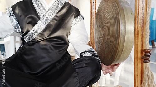 A person plays Korean percussion instruments with skill