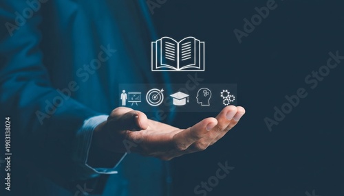 A businessman holding icons representing education and learning in his hand