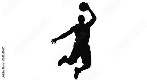 Silhouette of a basketball player in mid air preparing to shoot or dunk