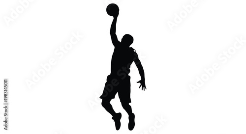 Silhouette of a basketball player in mid air preparing to dunk the ball