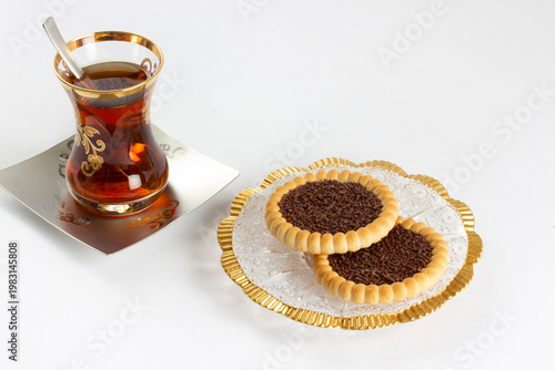 a cup of tea and some snack biscuits