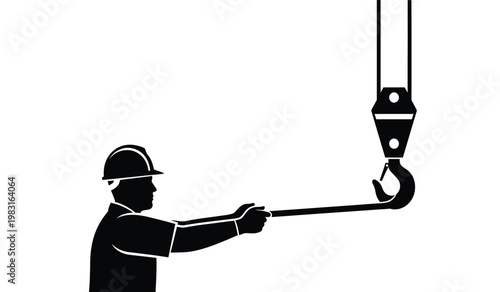 A stark black and white image depicts a construction worker operating a crane hook showcasing industrial strength and safety protocols silhouette high quality professional
