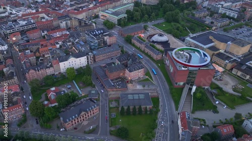 Aarhus, Jutland, Denmark - Aerial Drone View in Evening Twilight at ARoS Aarhus Art Museum. Shining Colorful Circle.