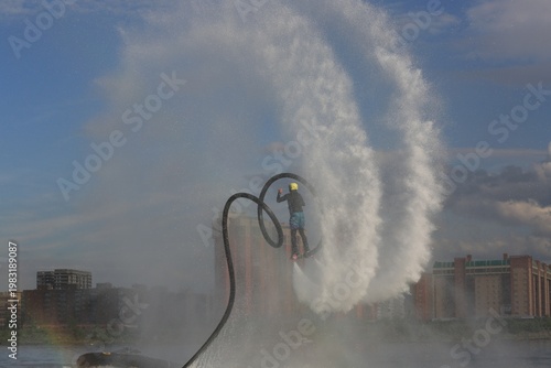 Flyboarding is an extreme water sport and entertainment that allows a person to float in the air above the water using a powerful water flow.