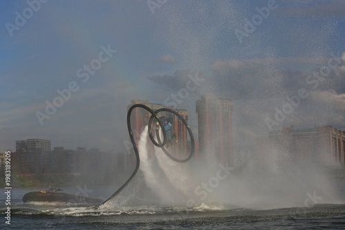 Flyboarding is an extreme water sport and entertainment that allows a person to float in the air above the water using a powerful water flow.
