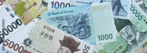 South Korean won money banknotes pile on table. South Korea bills of KRW currency close up