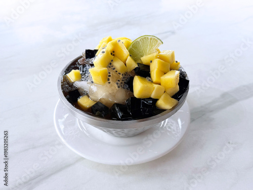 Thai chilled mango sago fruit with chia seed lime and herbal jelly snow iced drink in bowl sweet cold dessert menu cafe halal vegan food
