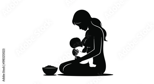 Silhouette of a mother breastfeeding her baby in a peaceful setting