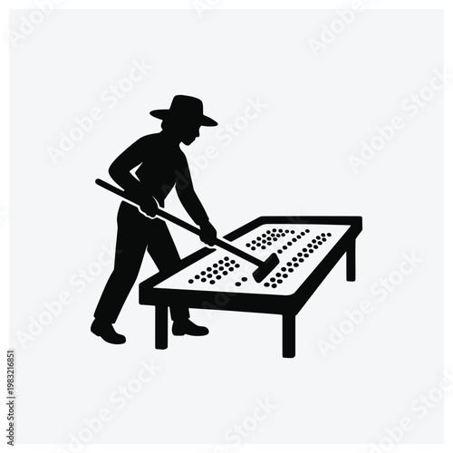 Man cleaning a pool table with a billiard brush