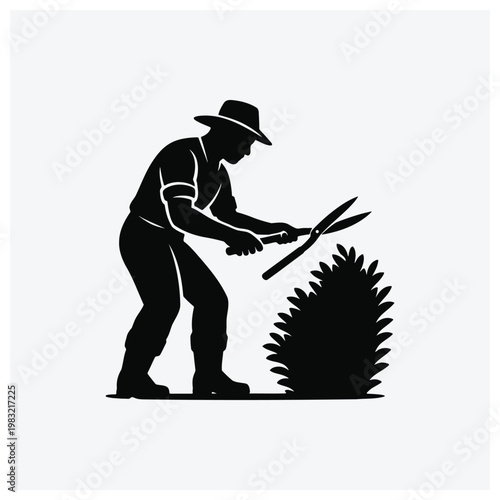Silhouette of a gardener trimming a bush with shears.