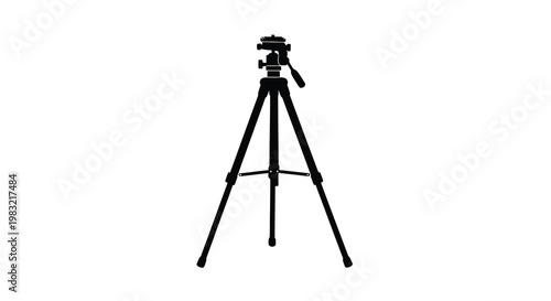 A silhouette of a black tripod with a camera mounted on top