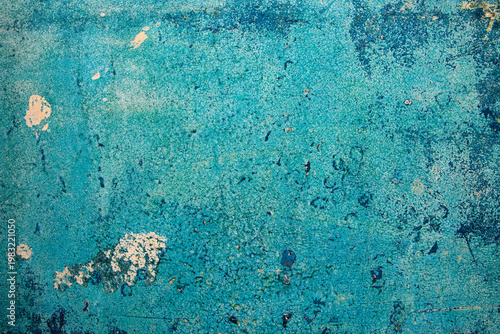Bild auf Leinwand Peeling blue paint on corroded metal surface with rust stains and layered weathering creating an abstract aged pattern