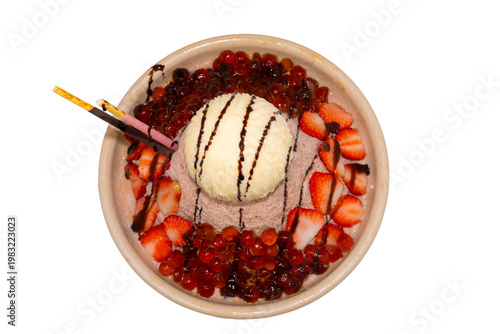 A decadent chocolate shaved ice bowl topped with vanilla ice cream, fresh strawberry slices, boba pearls, and chocolate-dipped biscuit sticks