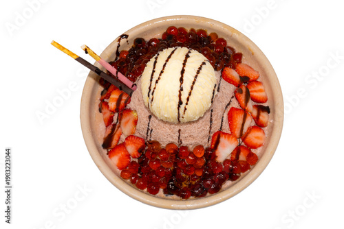 A decadent chocolate shaved ice bowl topped with vanilla ice cream, fresh strawberry slices, boba pearls, and chocolate-dipped biscuit sticks