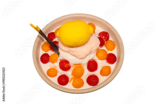 A refreshing bowl of fruit bingsu featuring shaved ice, melon and watermelon scoops, topped with a lemon-shaped dessert and Pocky.