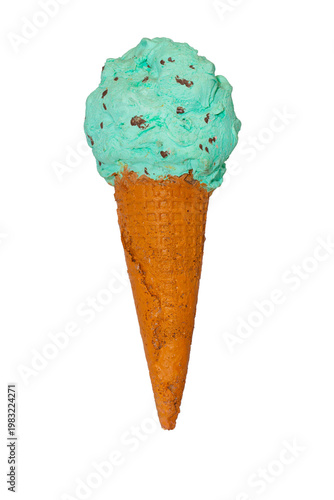 A large scoop of mint chocolate chip ice cream sits atop a brown waffle cone against a plain white background.