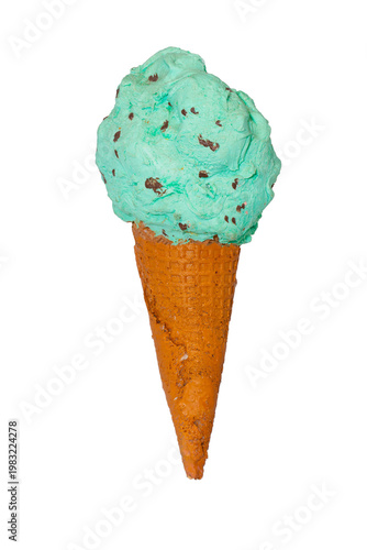 A large scoop of mint chocolate chip ice cream sits atop a brown waffle cone against a plain white background.