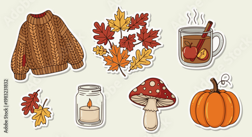 Cozy autumn collection sweater, leaves, hot drink, candle, mushroom, and pumpkin