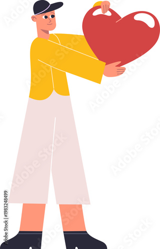 Young man holding a large red heart, symbolizing love, care, and giving