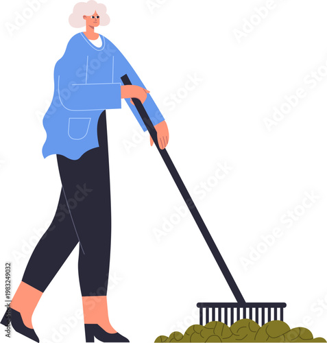 Senior woman raking a pile of fallen leaves, symbolizing garden clean up and seasonal chores