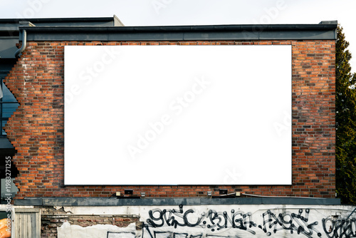 Blank advertising poster on a scenic brick wall in the city