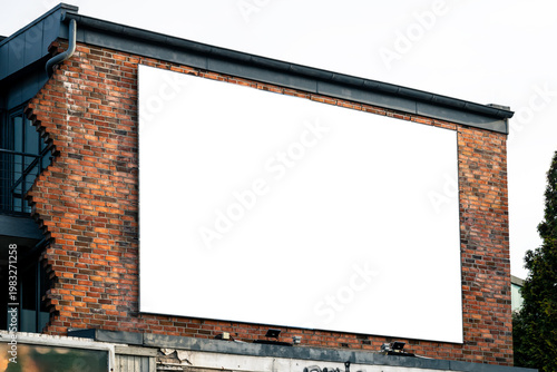 Blank marketing poster on a scenic brick wall in the city