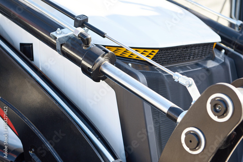 Photos Hydraulic piston and linkage on construction machinery close-up