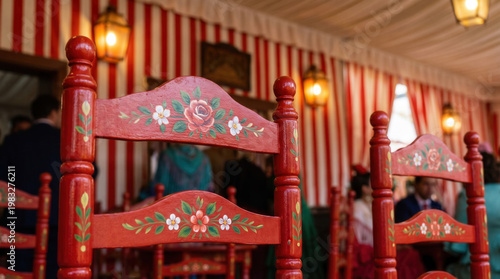 Traditional Andalusian chairs inside Seville fair caseta with decor