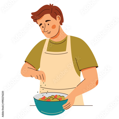 Contented man in an apron add seasonings onto a fresh salad. Cooking scene featuring healthy food