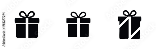 Set of three black icons of gift boxes with ribbons