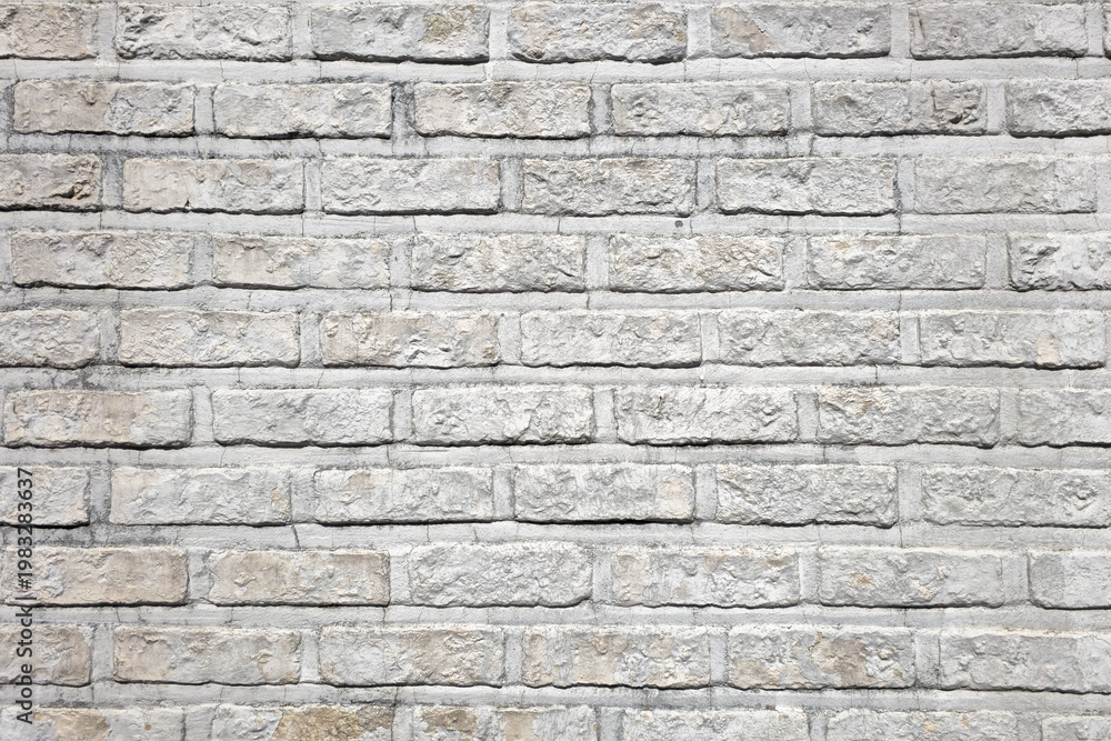 Obraz premium Light brick wall texture with uniform pattern and clean surface creating minimal architectural background.