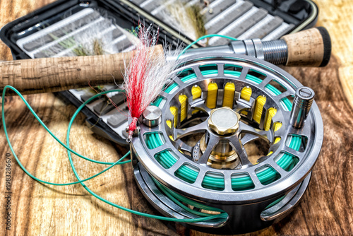 Close up of a flyfishing rod, reel, and flies