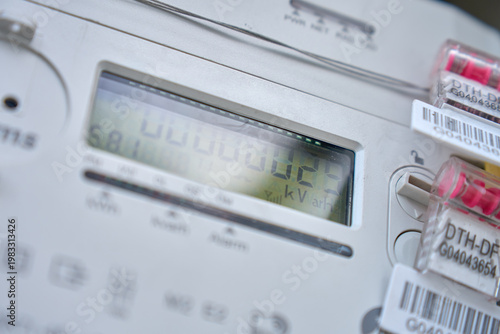 Foto Close up of digital electricity meter with display and security seals