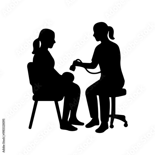 Obstetrician performing ultrasound on a pregnant woman