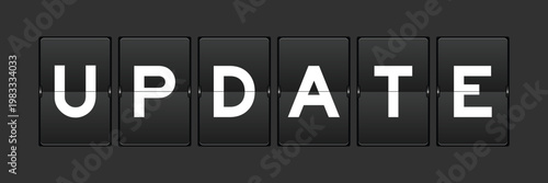 Black color analog flip board with word update on gray background