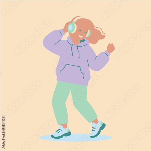 Young Woman Dancing Joyfully While Listening to Music with Headphones.