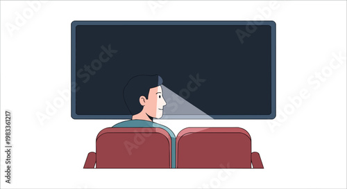Man sitting in theater seat watching a large blank screen