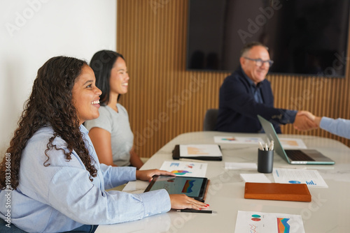 Multi generational business people working together inside modern office - Multiracial colleagues, job deal and corporate concept