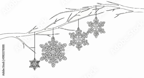 Delicate snowflake ornaments dangle from a barren branch