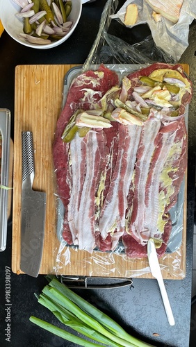 Close-up of raw beef roll w...