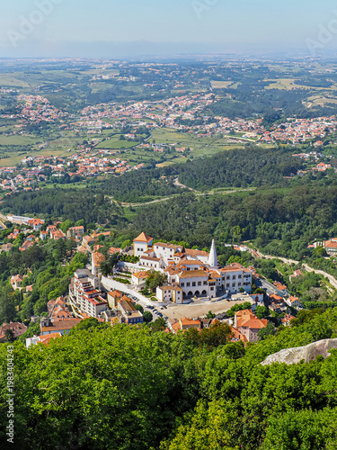 Фотография Sintra cityscape and National Palace, white building with conical chimneys from the mountain top